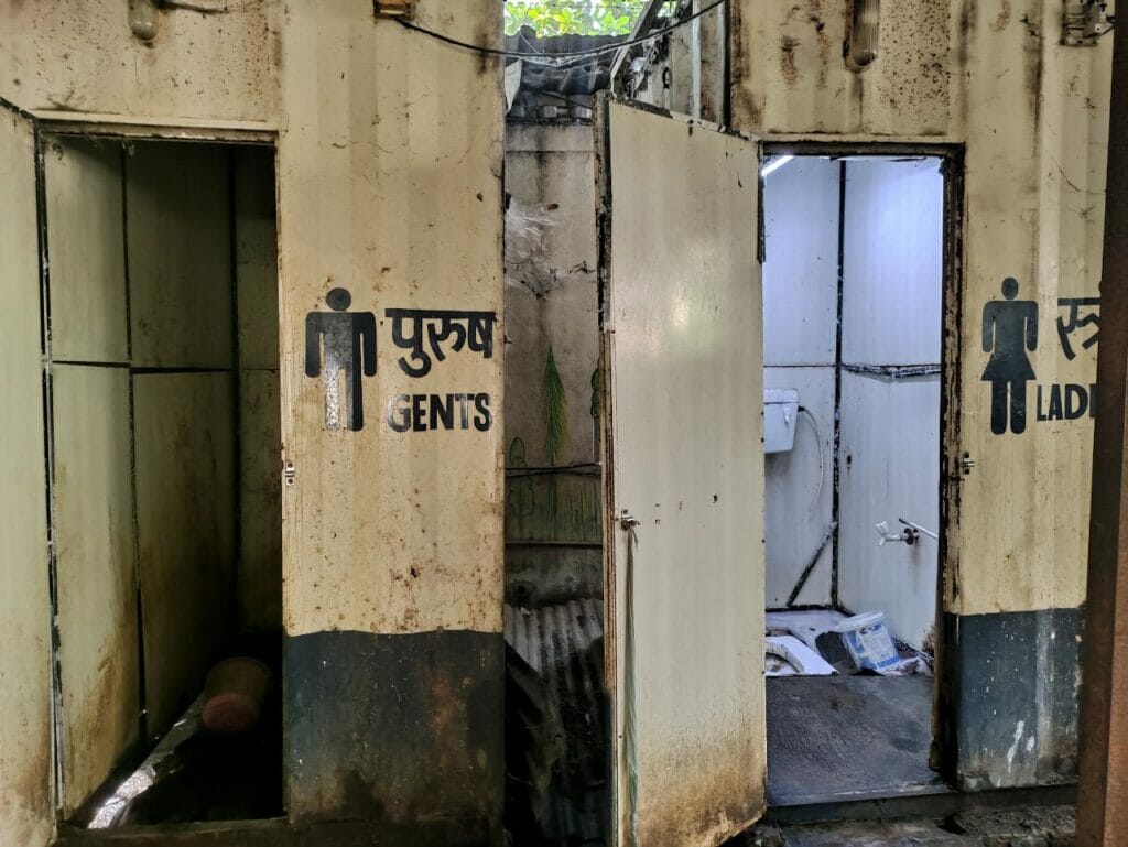 Picture of women's toilet and men's toilet side by side. 