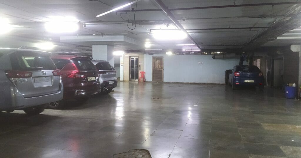 An almost empty underground parking facility below a busy Bandra mall. 