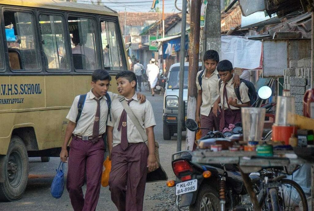 Boys in school uniform walking on the street