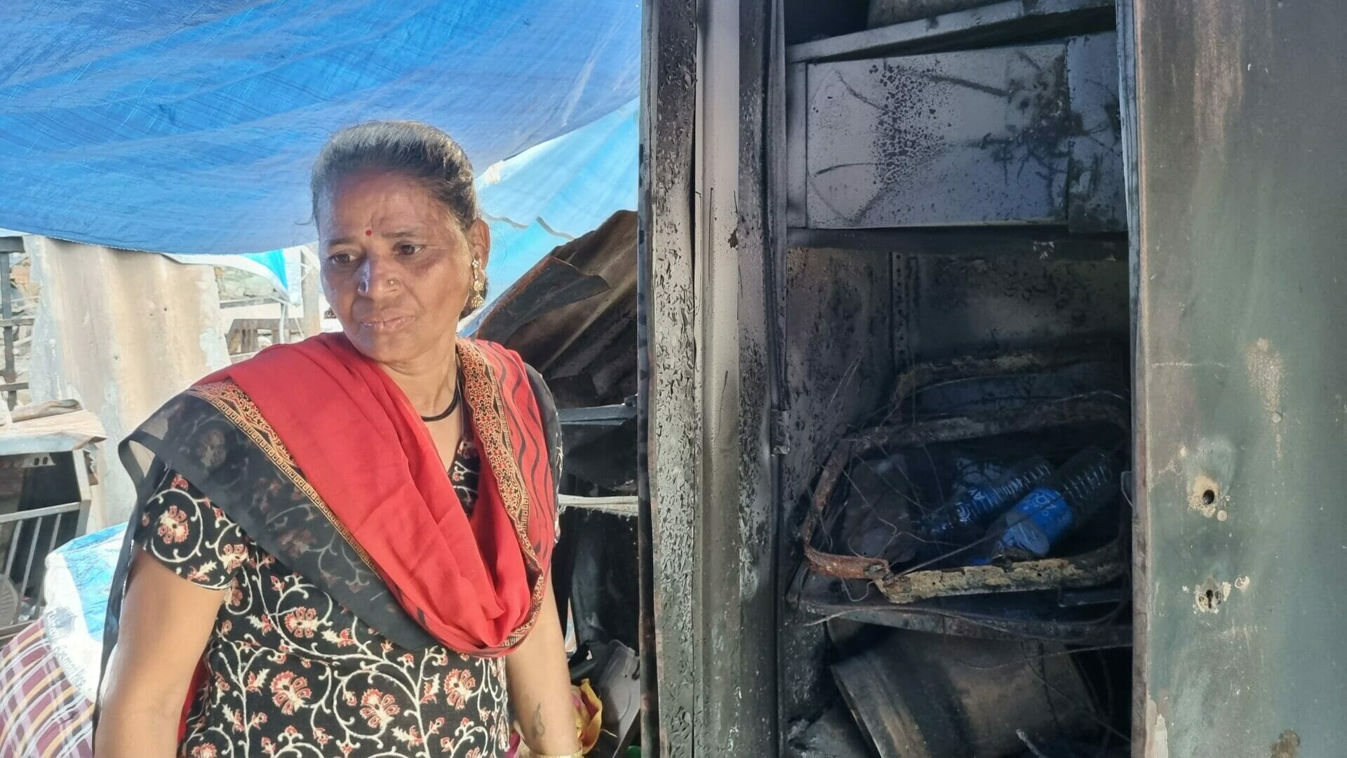 Radha at her house that was burnt in fire