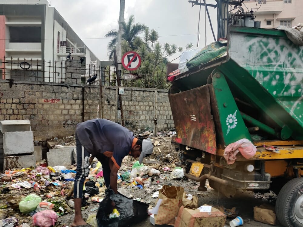 A boy sifting through garbage