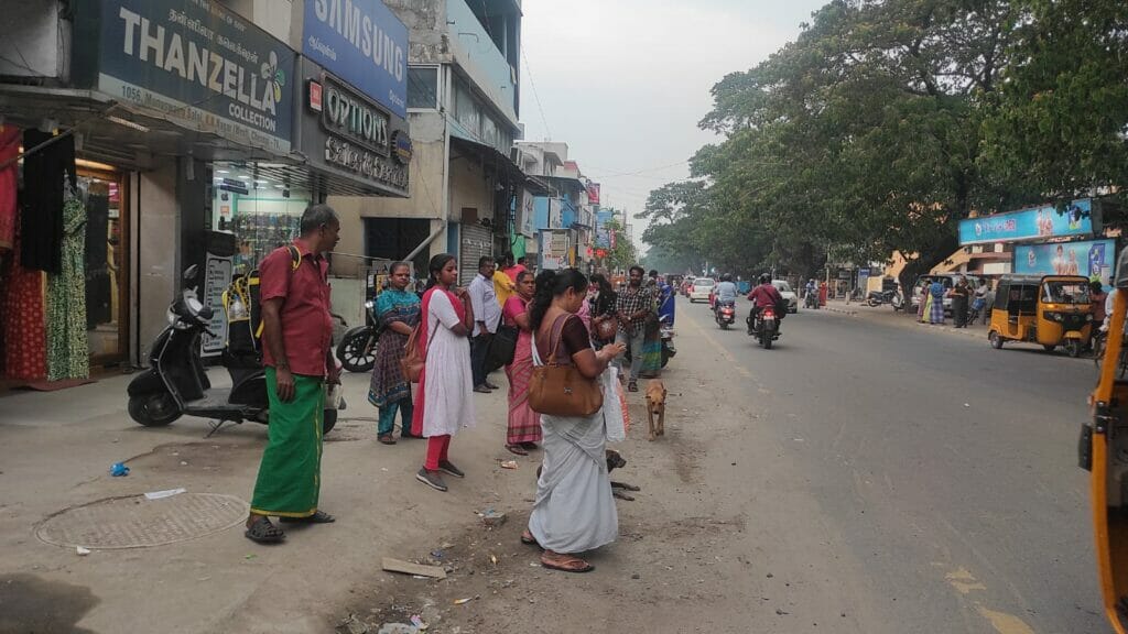 women standing on the road for bus 