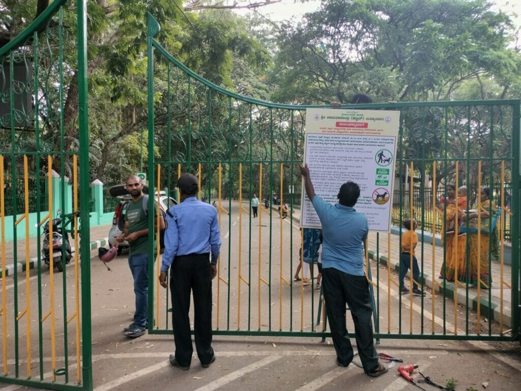 Regulations being hung up at Cubbon Park entrance