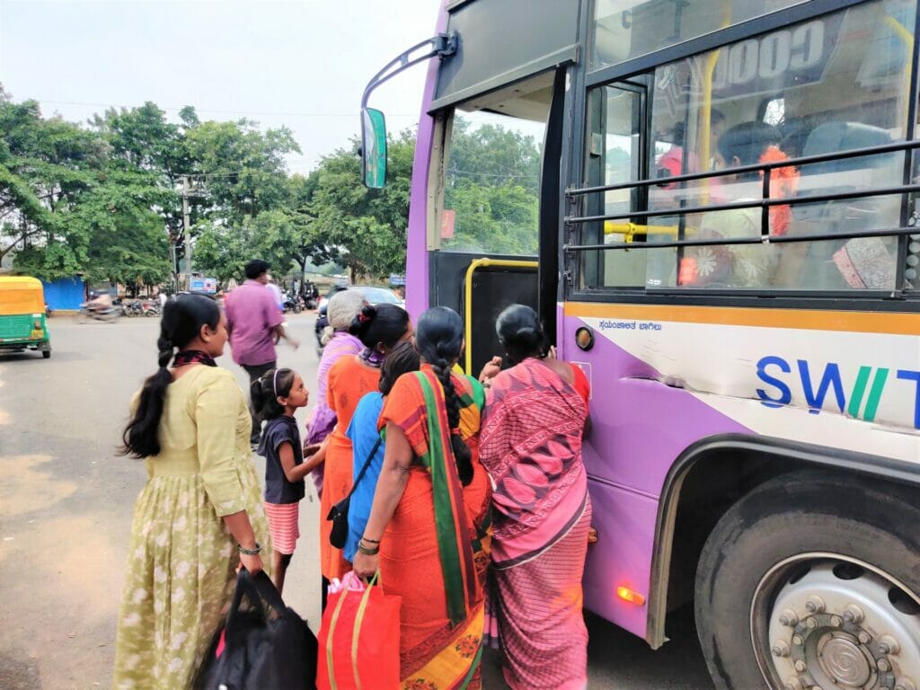 A group of women boarding a BMTC bus