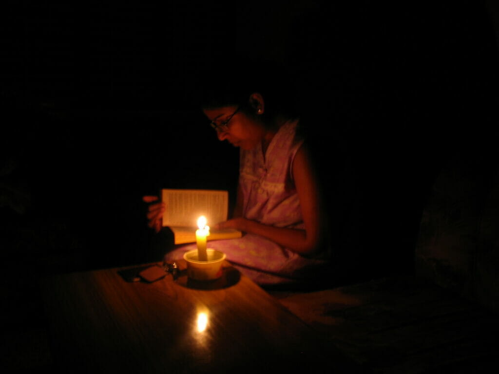 reading under candle light