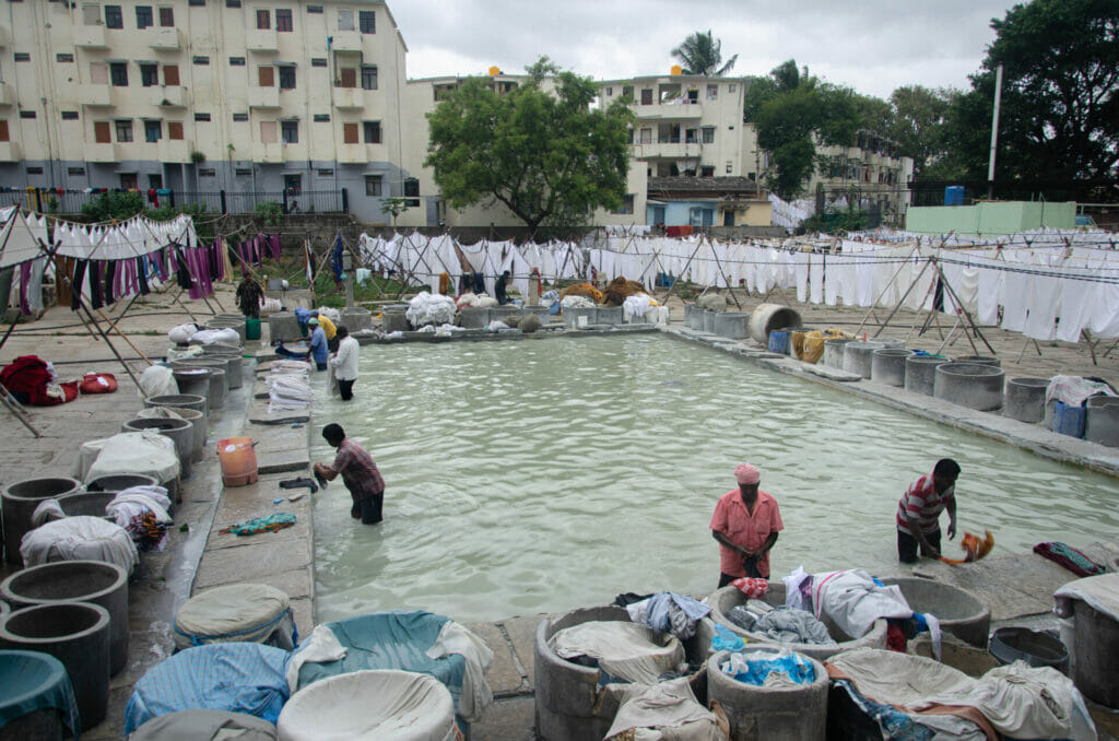 Dhobis washing clothes at a dhobi ghat
