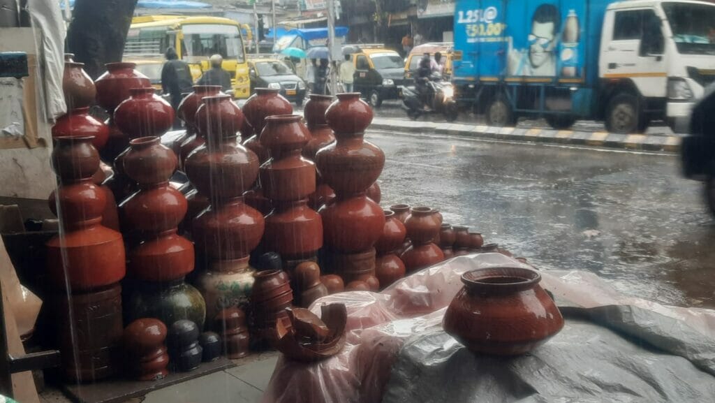 Shop with lots of earthern pots located at the 90-feet road in Dharavi on a heavy rain day
