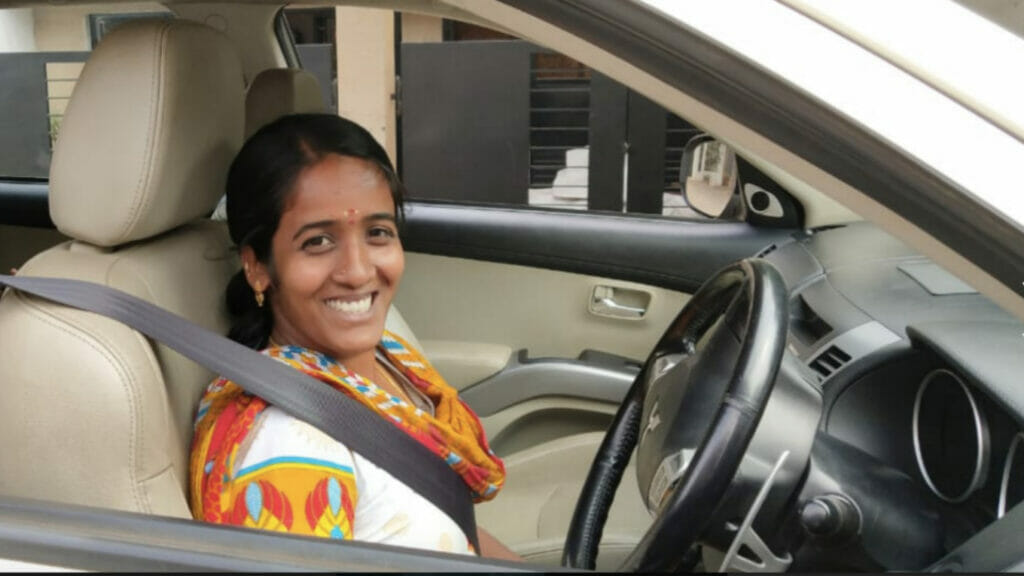 A woman cab driver with TaxShe