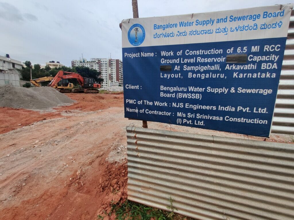 A display board with an announcement by BWSSB that the alleged lake and grazing land have been allotted to BWSSB as a CA site.