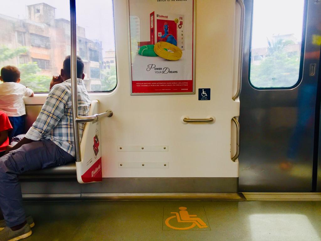 Designated spot for wheelchair users in the metro. 