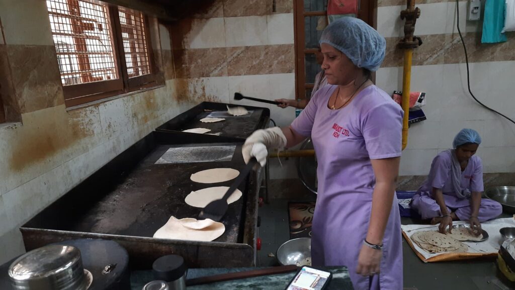 Workers making rotis in the revamped kitchen at KEM hospital. 