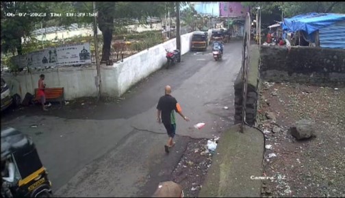 screen grab of a man throwing garbage 