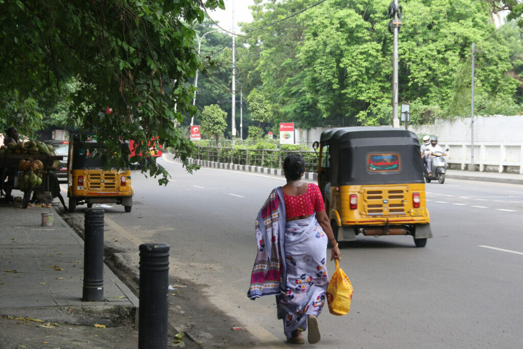woman with yellow bag walking