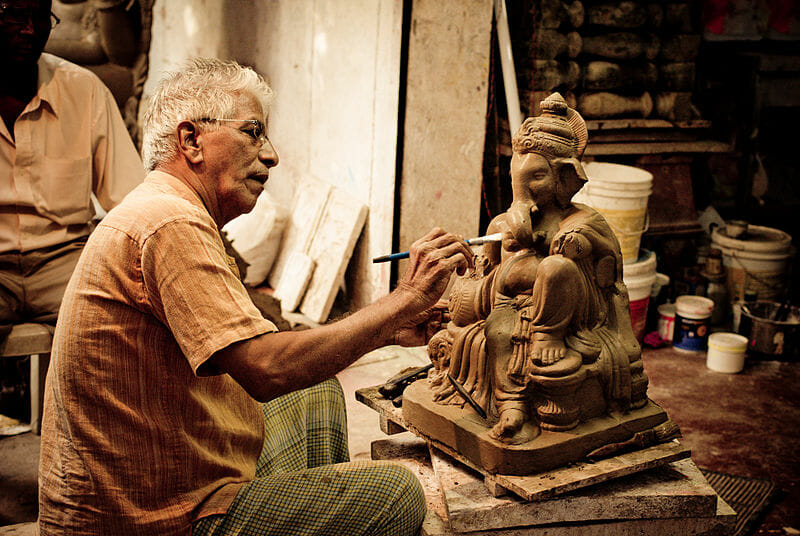 The making of a Ganesha idol. https://en.wikipedia.org/wiki/Ganesh_Chaturthi#/media/File:Chitrashalagoa.jpg