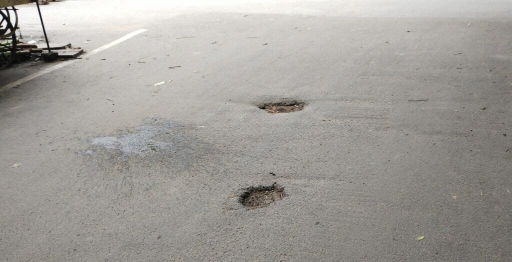 chennai road with potholes