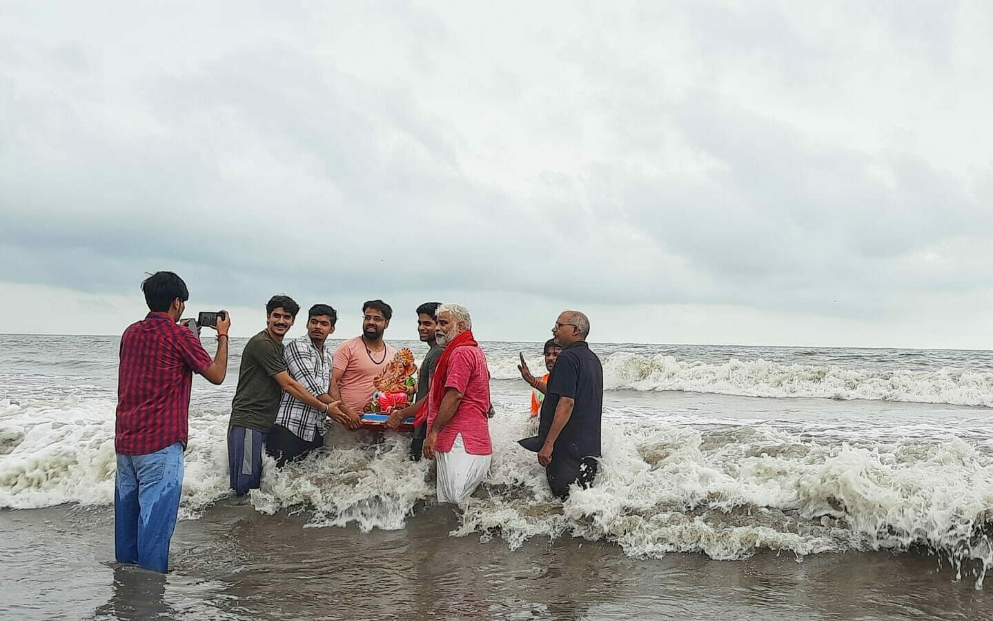 The last selfie before dipping the Idol in water. That's how many people capture memories with Bappa. Pic: Stephin Thomas