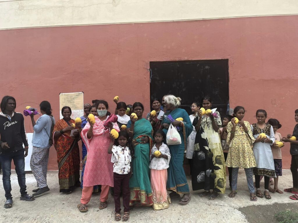 Women and children holding mangoes https://www.facebook.com/photo?fbid=251233563958384&set=pcb.251233660625041