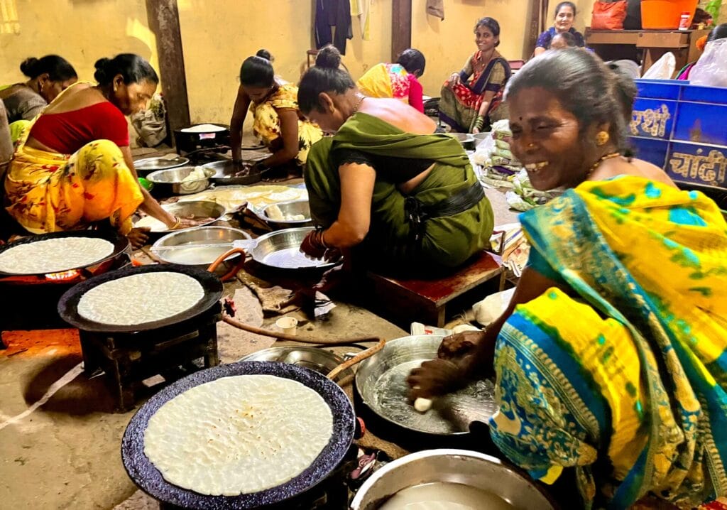 A group of women making rice bhakri at the Koliwada village 