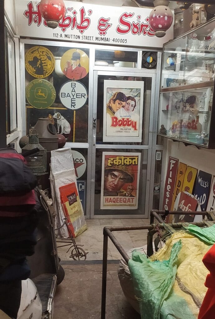 shop with film poster and other knick knacks at chor bazaar 