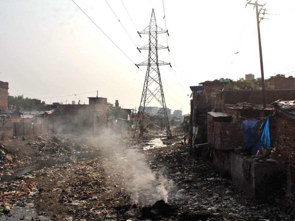 Waste and sewage in the slum areas near Bindal Bridge of Dehradun.