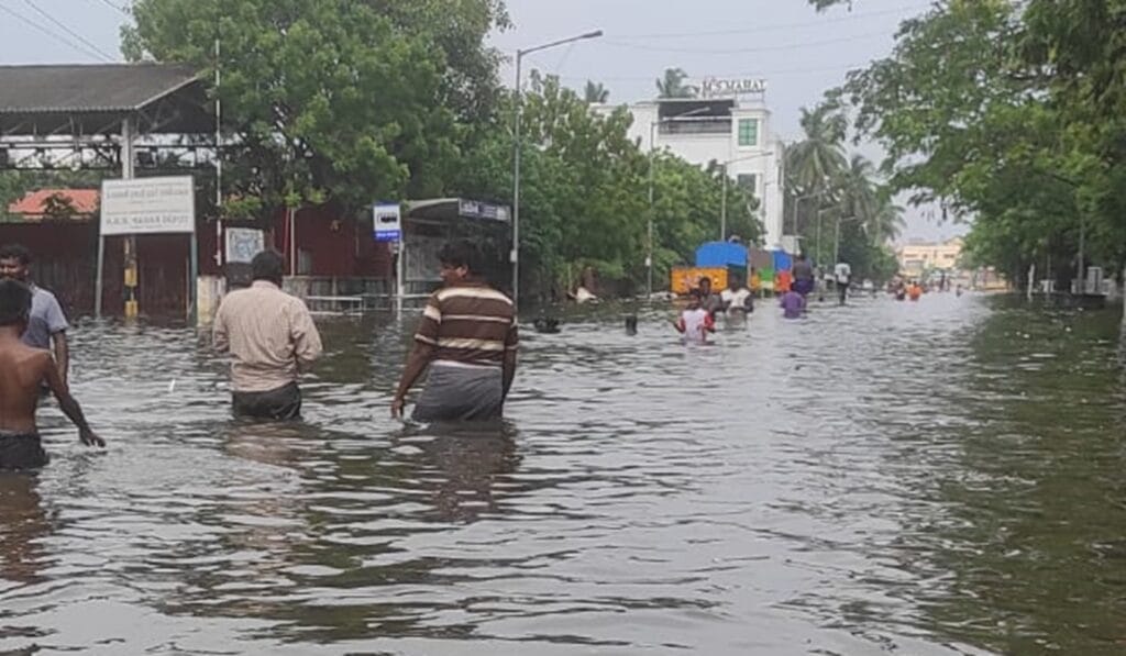 People walking in flooded streets in North Chennai