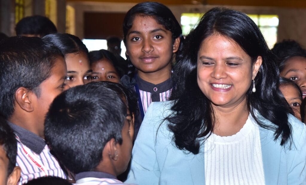 Meera Raman with school students