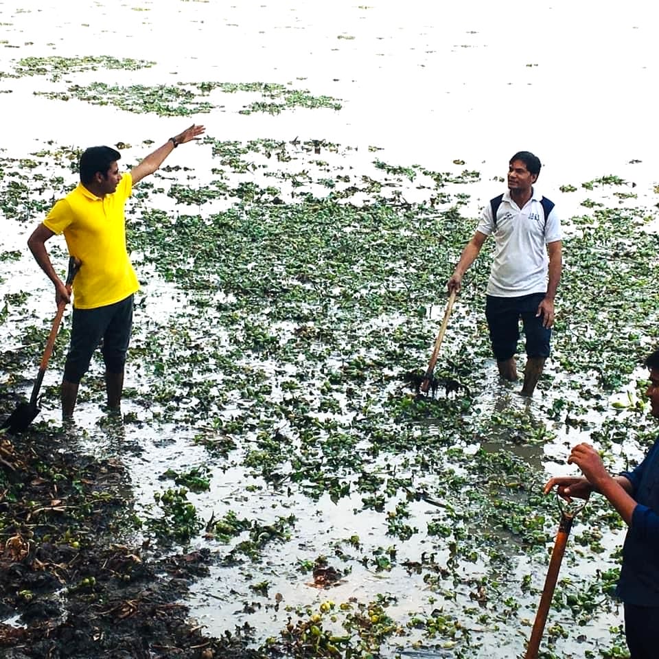 Environmentalists working at the Surajpur wetland in New Delhi