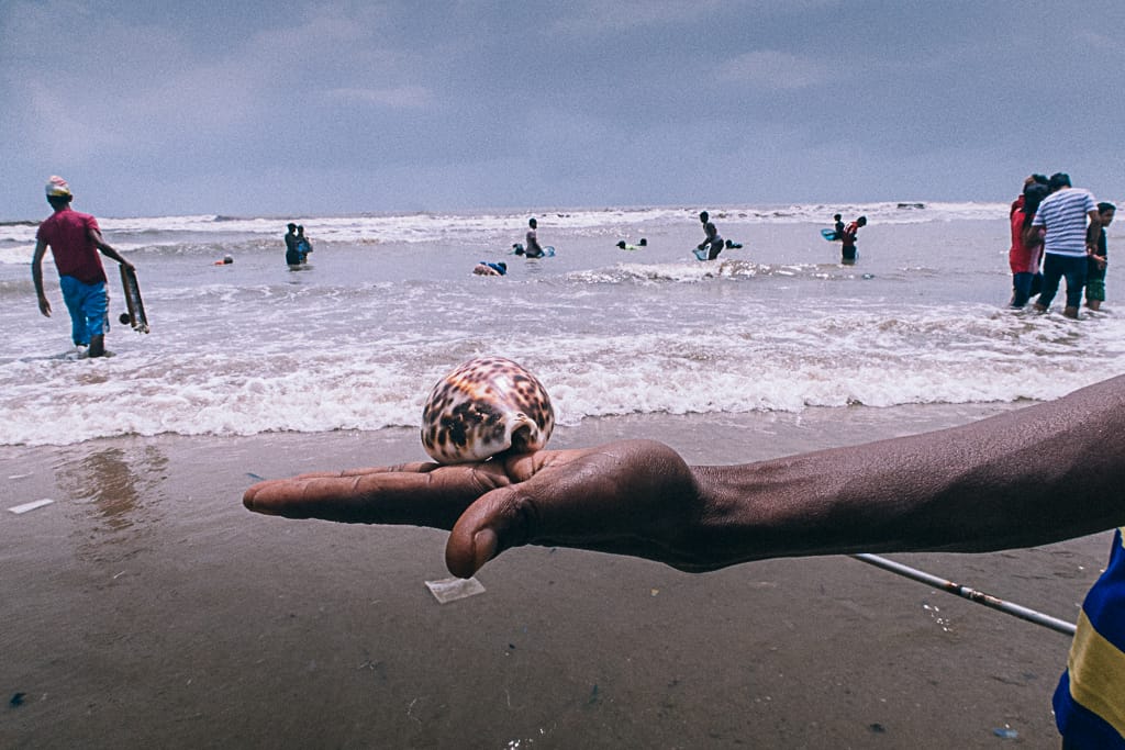 Man holding shell 